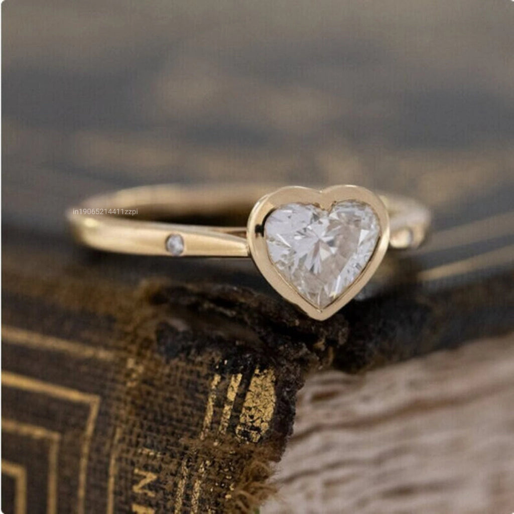1.5 Carat Heart Shaped Moissanite Solitaire Ring with Floating Rounds Tapered Band Symbolic Bezel Set Gemstone Rings