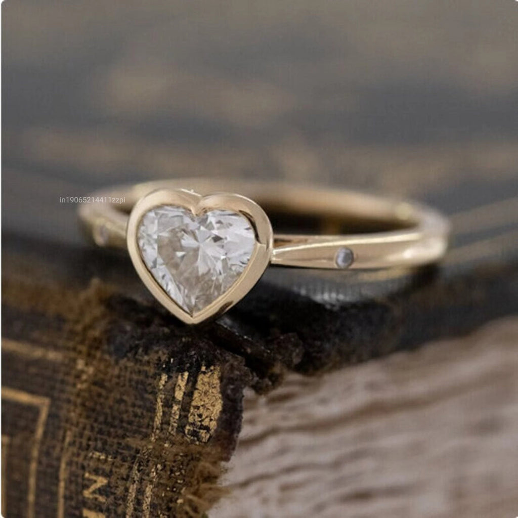 1.5 Carat Heart Shaped Moissanite Solitaire Ring with Floating Rounds Tapered Band Symbolic Bezel Set Gemstone Rings
