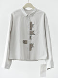 [EAM] Women White Pattern Patch Spliced Big Size Blouse New Lapel Long Sleeve Shirt Fashion Tide Spring Autumn 2026 1DJ6229