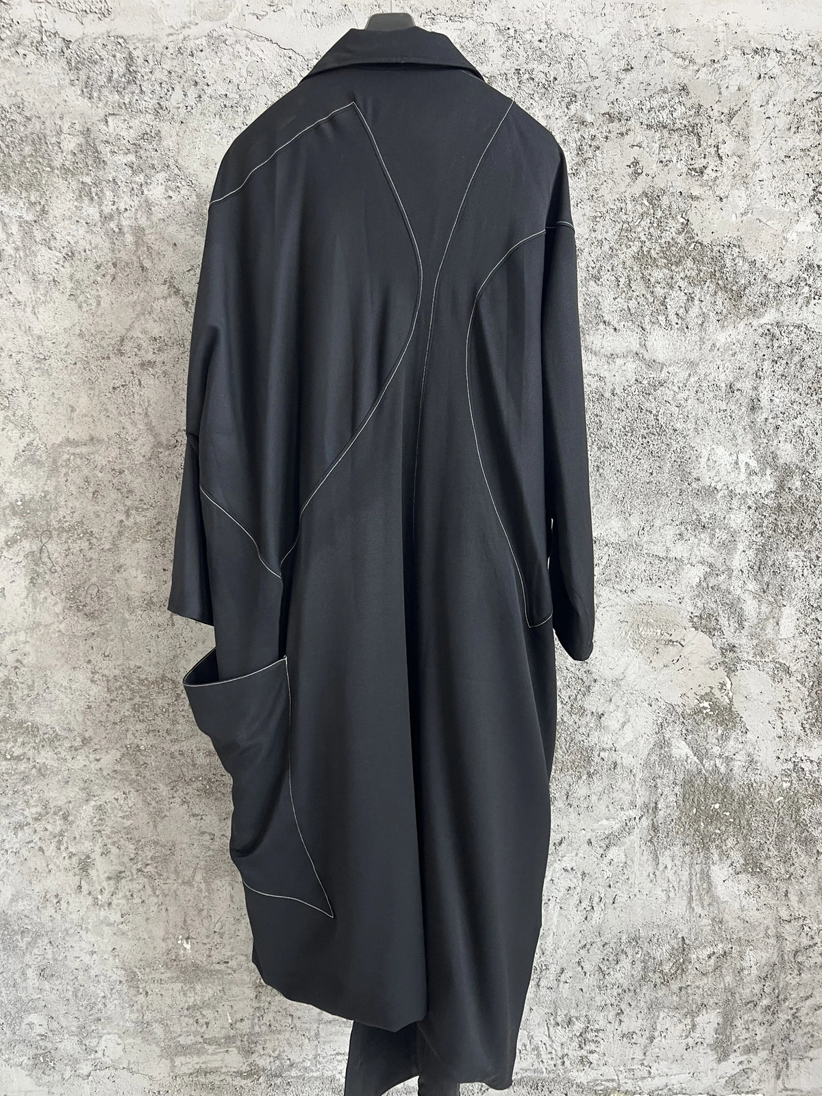 TOP-YAMAMOTO, a niche designer of mid-length trench coats made of pure wool with fringed edges