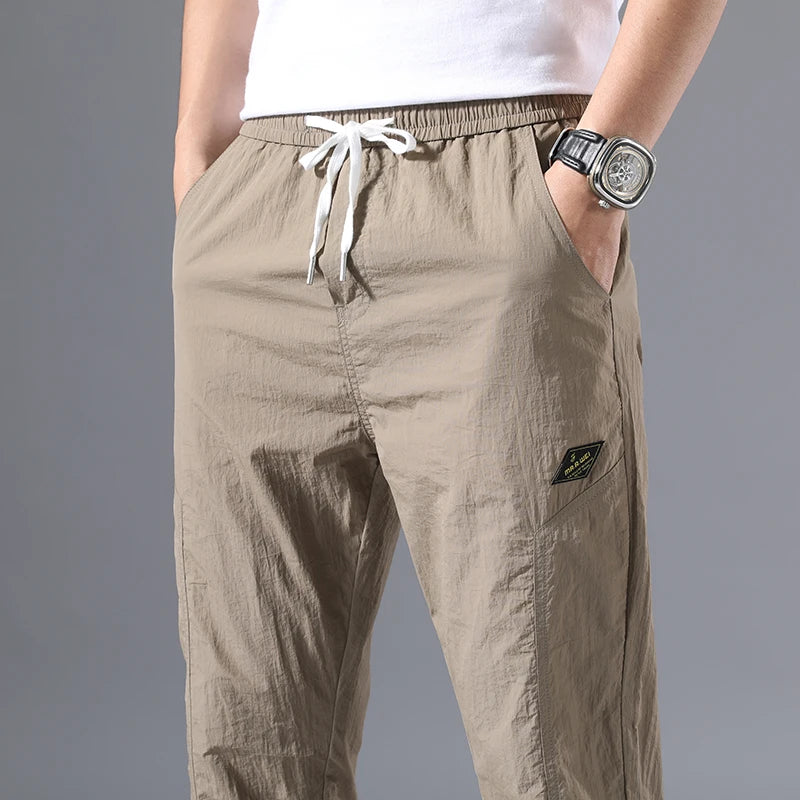 2026 Summer Thin Men's Wrinkled Fabric Loose Tapered Harem Pants Quick-Dry Elastic Cuff Casual Trousers Elastic Waist City Boy