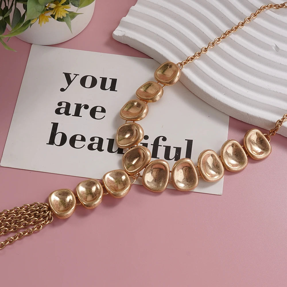 Gold-Tone Statement Necklace Y Shaped with Textured Oval Elements and Chain Tassel Vintage Inspired Fashion Piece for Bold Styli