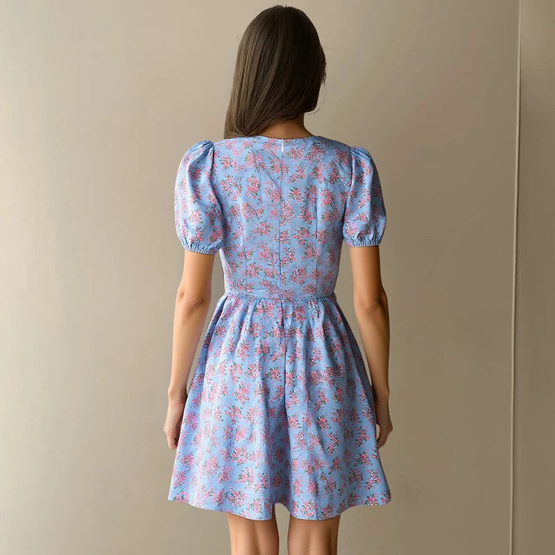 Hugcitar 2026 Floral Print V Neck Short Sleeve Lace Up Zip Up Sexy Slim Pleated Mini Dress Summer Elegant Outfits Party Vacation