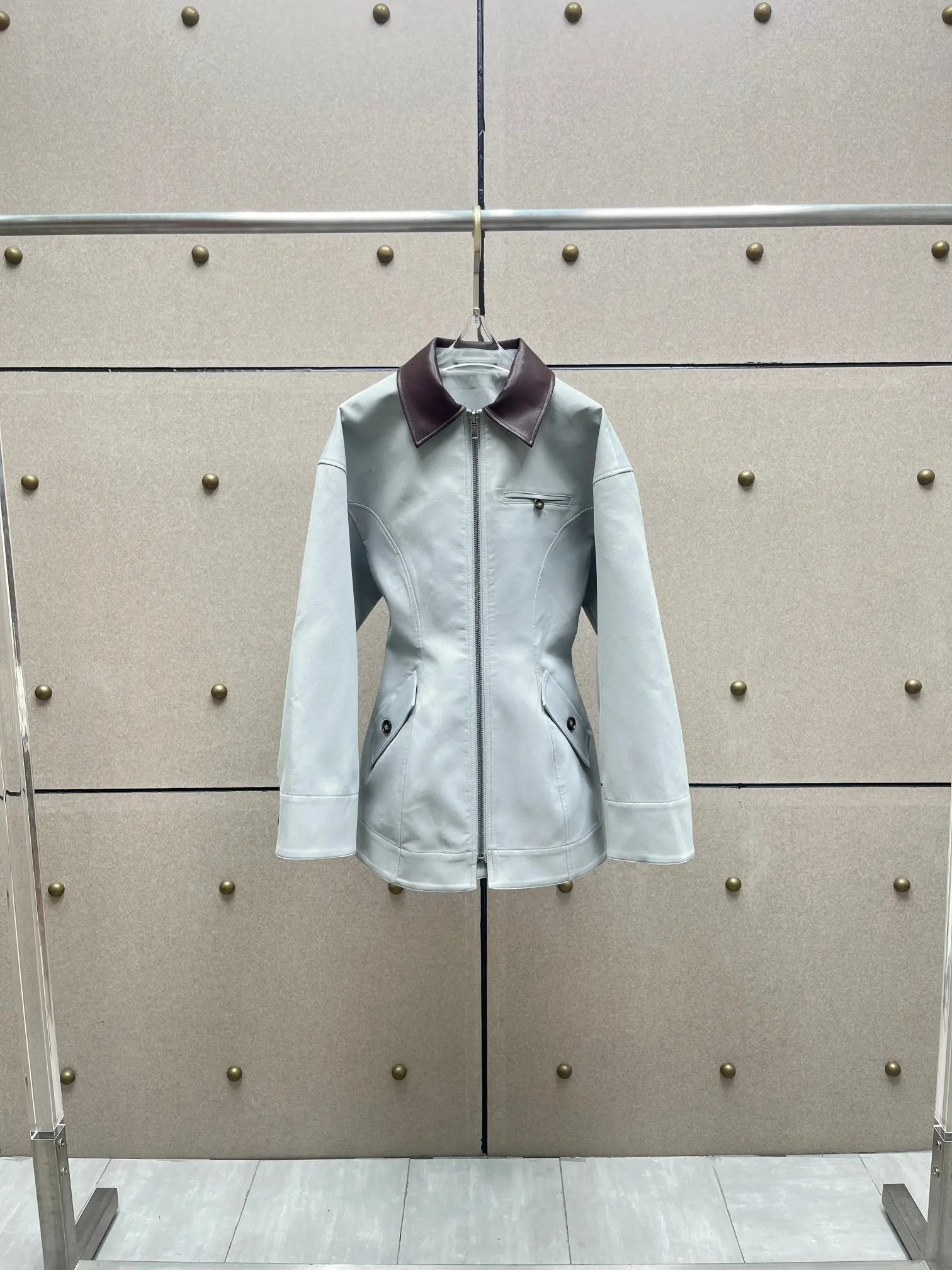 Leather-paneled jacket, a vintage, old-money style contrasting color lapel long-sleeved women's jacket.