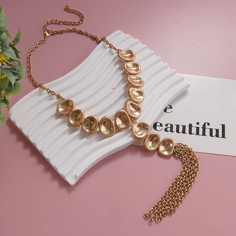 Gold-Tone Statement Necklace Y Shaped with Textured Oval Elements and Chain Tassel Vintage Inspired Fashion Piece for Bold Styli