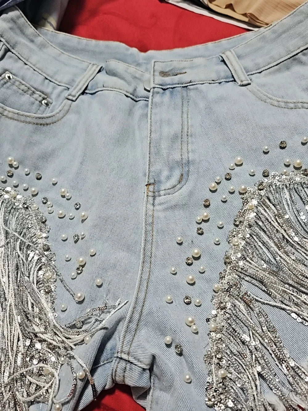 Women High-Waisted Rhinestone Pearl Fringe Denim Shorts Light Wash Distressed Design with Sparkly Belt Tassel Trim Shorts