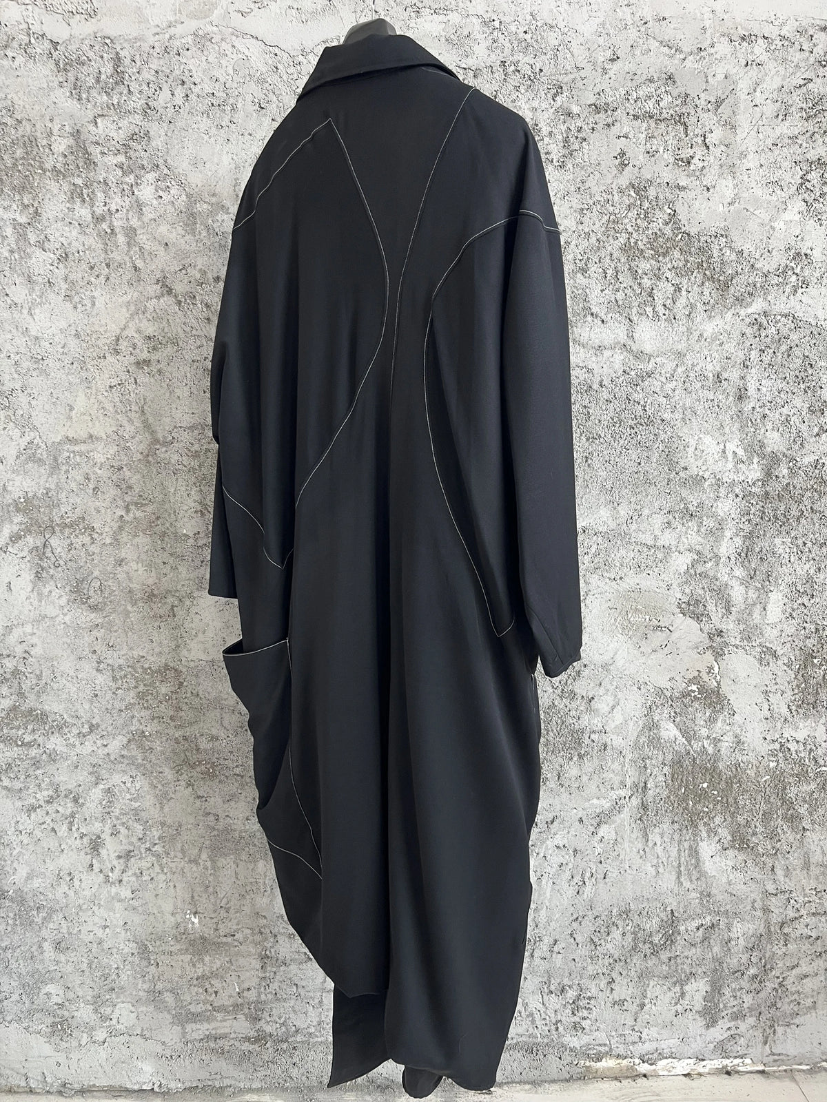 TOP-YAMAMOTO, a niche designer of mid-length trench coats made of pure wool with fringed edges