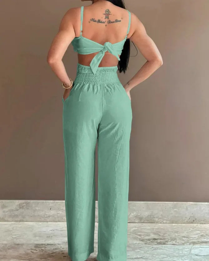 2026 Summer Spaghetti Strap Fashion Jumpsuit Women's Floral Pattern Hollow Casual Asymmetrical Collar Backless Jumpsuit Trousers