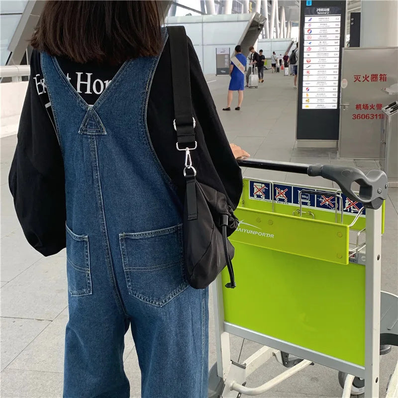 Versatile denim overalls for women, new design in spring and autumn 2026, retro style, loose straps, wide-leg long pants.