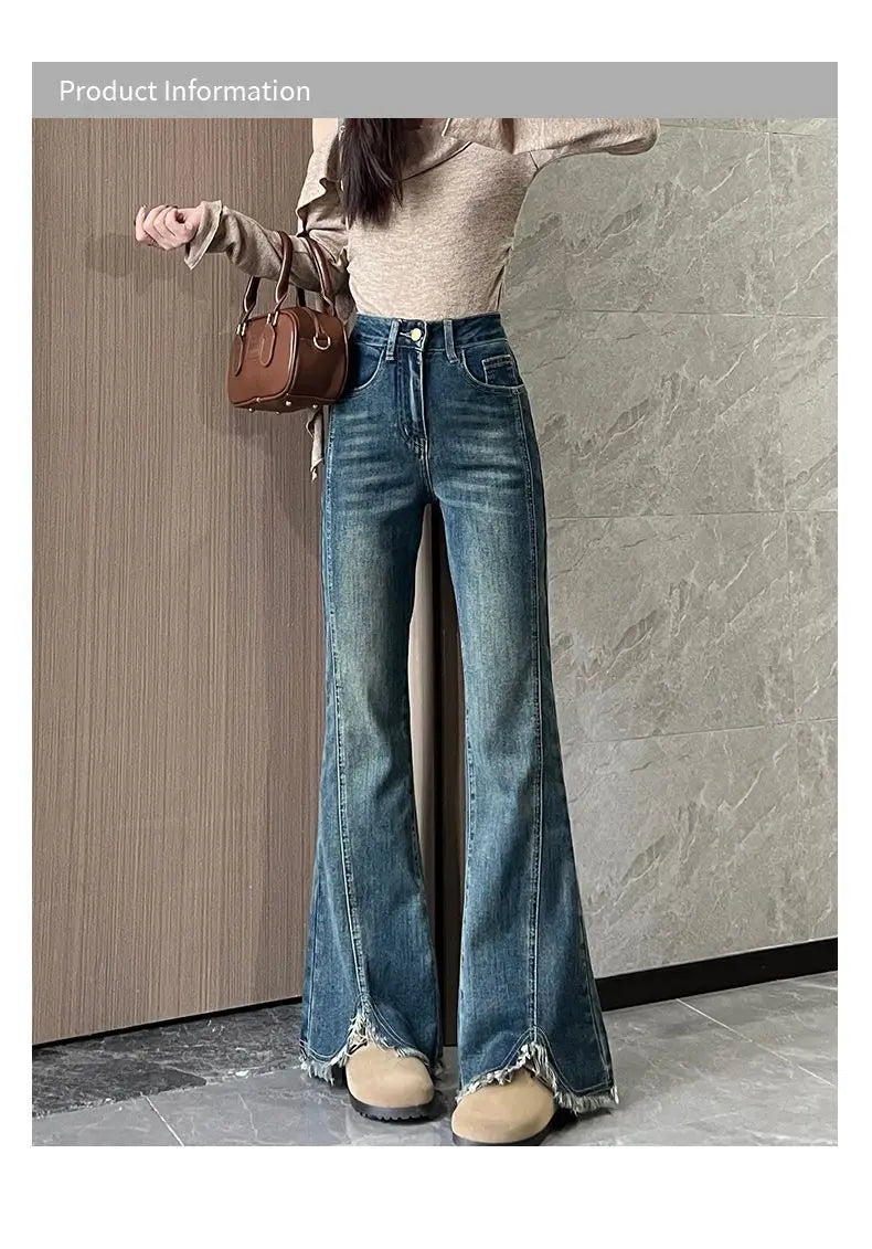 Women's stylish denim jeans, stretchy blue-gray with frayed edges, slit, high-waisted, leg-lengthening, flared