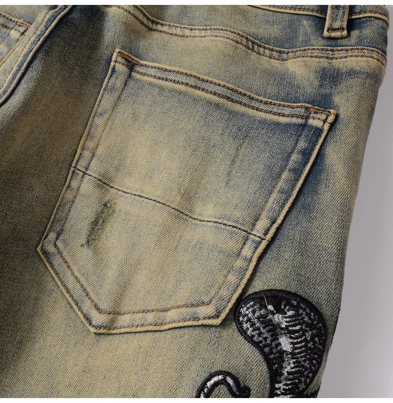 2026 New Men's Fashion Snake Embroidery Denim Jeans Vintage Blue Snakeskin Leather Patch Stretch Pants Skinny Tapered Trousers