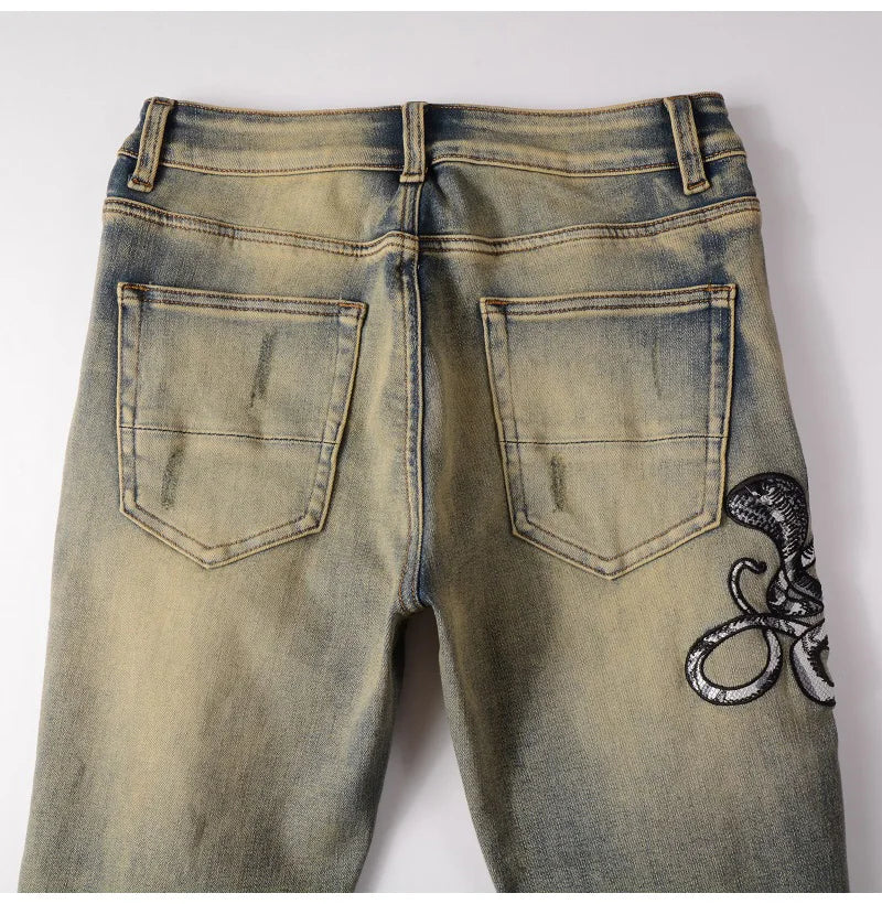 2026 New Men's Fashion Snake Embroidery Denim Jeans Vintage Blue Snakeskin Leather Patch Stretch Pants Skinny Tapered Trousers
