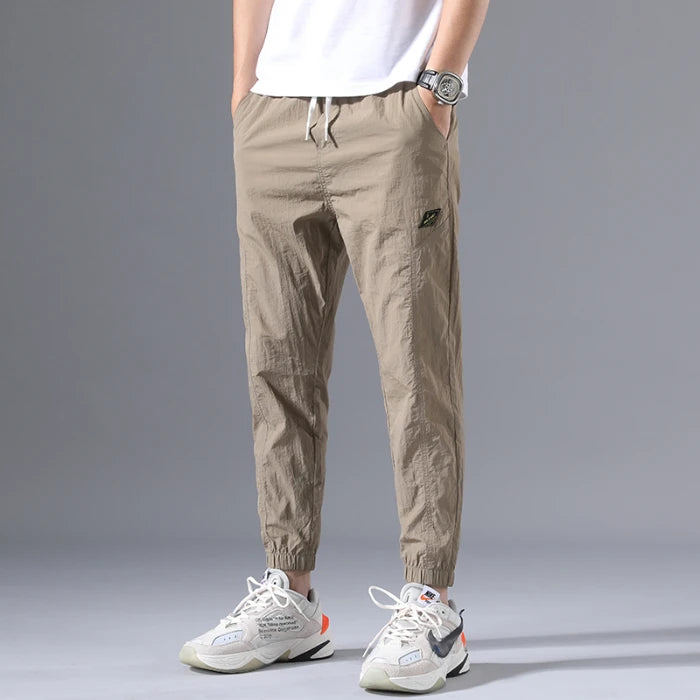 2026 Summer Thin Men's Wrinkled Fabric Loose Tapered Harem Pants Quick-Dry Elastic Cuff Casual Trousers Elastic Waist City Boy