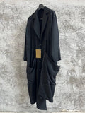 TOP-YAMAMOTO, a niche designer of mid-length trench coats made of pure wool with fringed edges